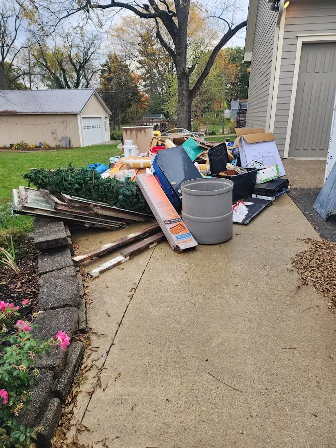 Dumpster being loaded with debris for 10 Yard Dumpster Rental in Brigantine
